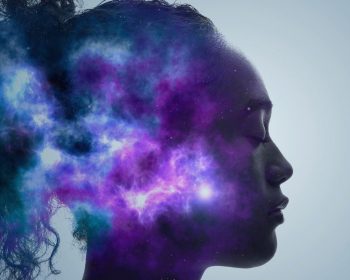 A woman in profile, with a purple nebula superimposed to cover here head.